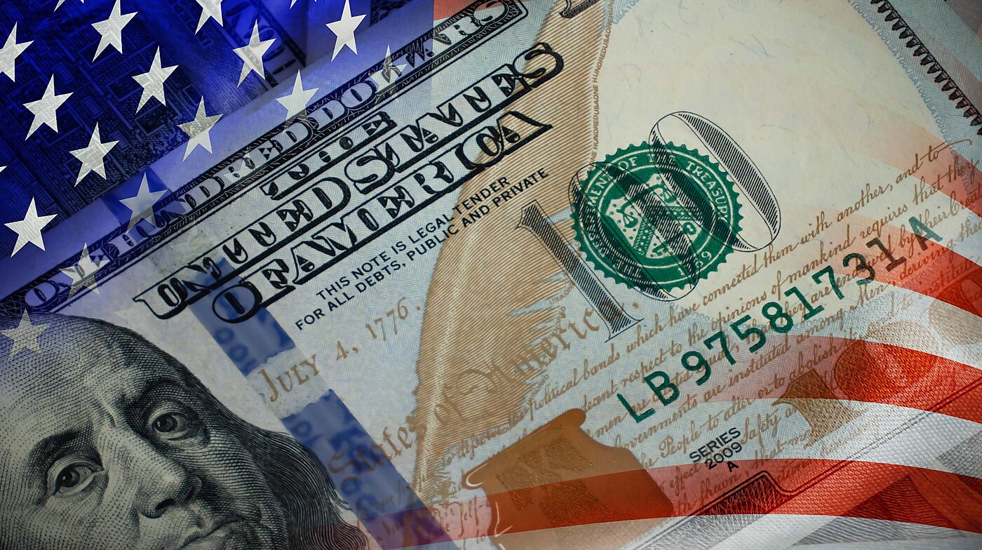 National flag of United States of America with 100 dollar bill overlay